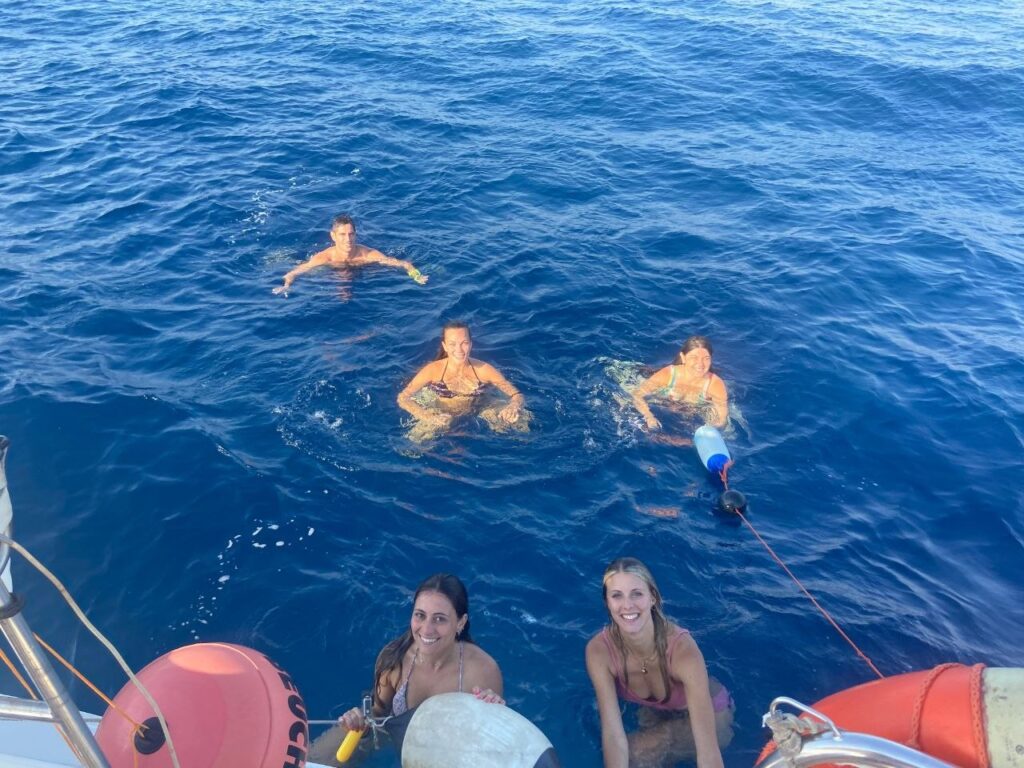 Guests enjoying a yacht birthday celebration on the Sicilian coast