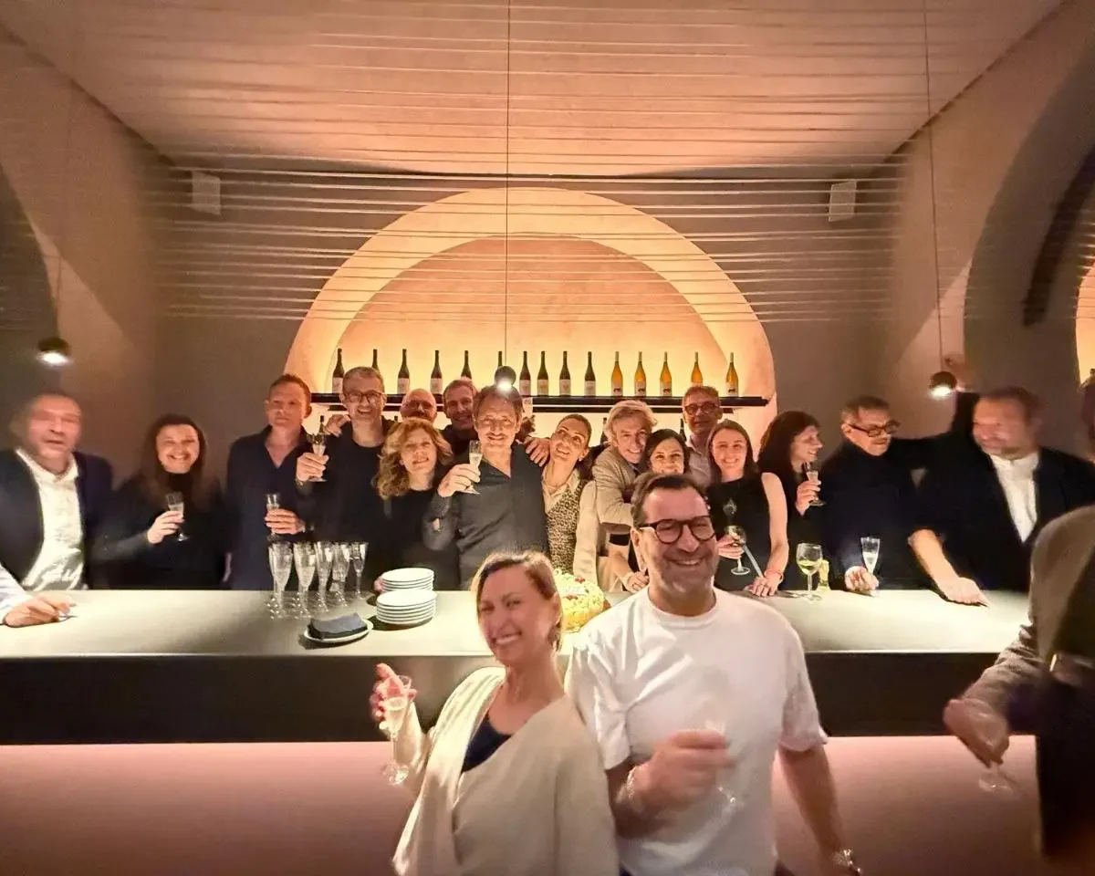birthday in sicily-Guests celebrating together at an elegant indoor luxury event in Sicily with wine, cocktails, and stylish evening atmosphere.